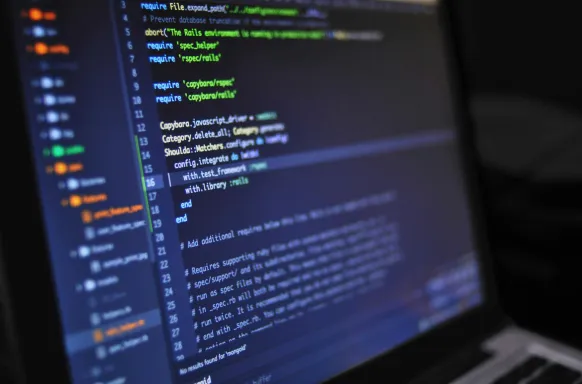 Close-up of custom software development code on a computer screen, showcasing the detail-oriented programming by our skilled software development company.